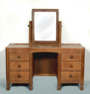 Appraisal: AN ADZED OAK DRESSING TABLE by Robert Mouseman Thompson of