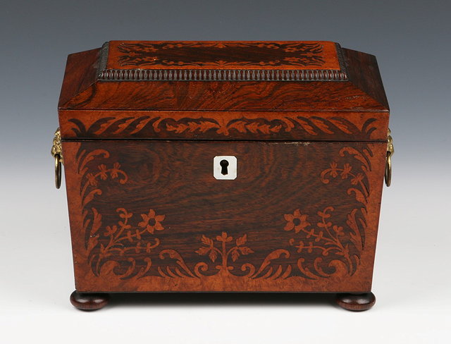 Appraisal: A VICTORIAN ROSEWOOD SARCOPHAGUS CADDY with marquetry inlaid decoration and