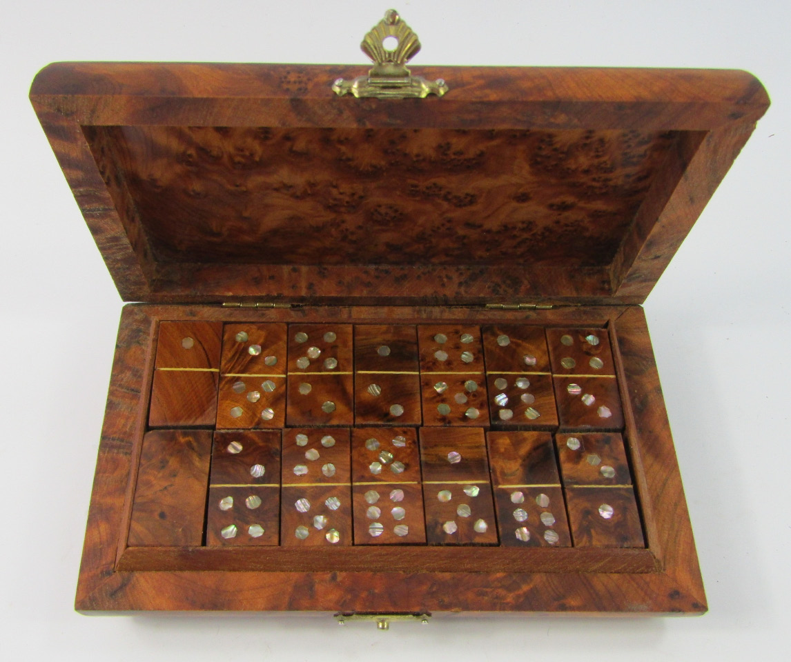 Appraisal: A Burr walnut travel domino set the shaped rectangular box