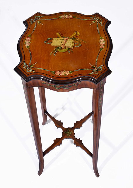 Appraisal: A SATINWOOD WINE TABLE with painted top with musical trophy