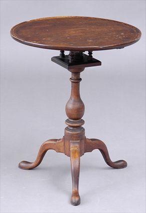 Appraisal: PENNSYLVANIA CHIPPENDALE WALNUT TILT-TOP CANDLESTAND The dished top on birdcage