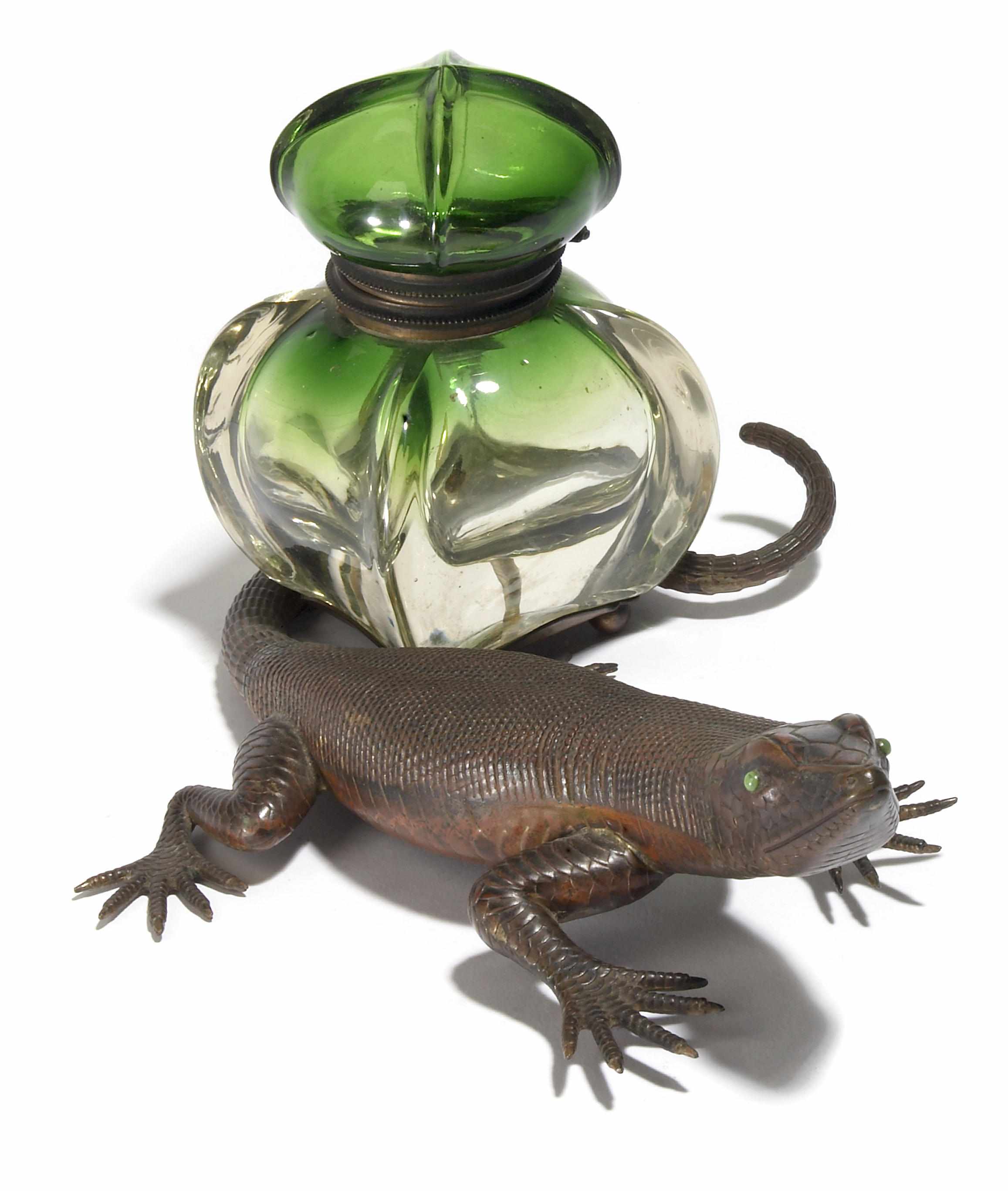 Appraisal: A Continental patinated bronze and glass lizard form inkwell probably