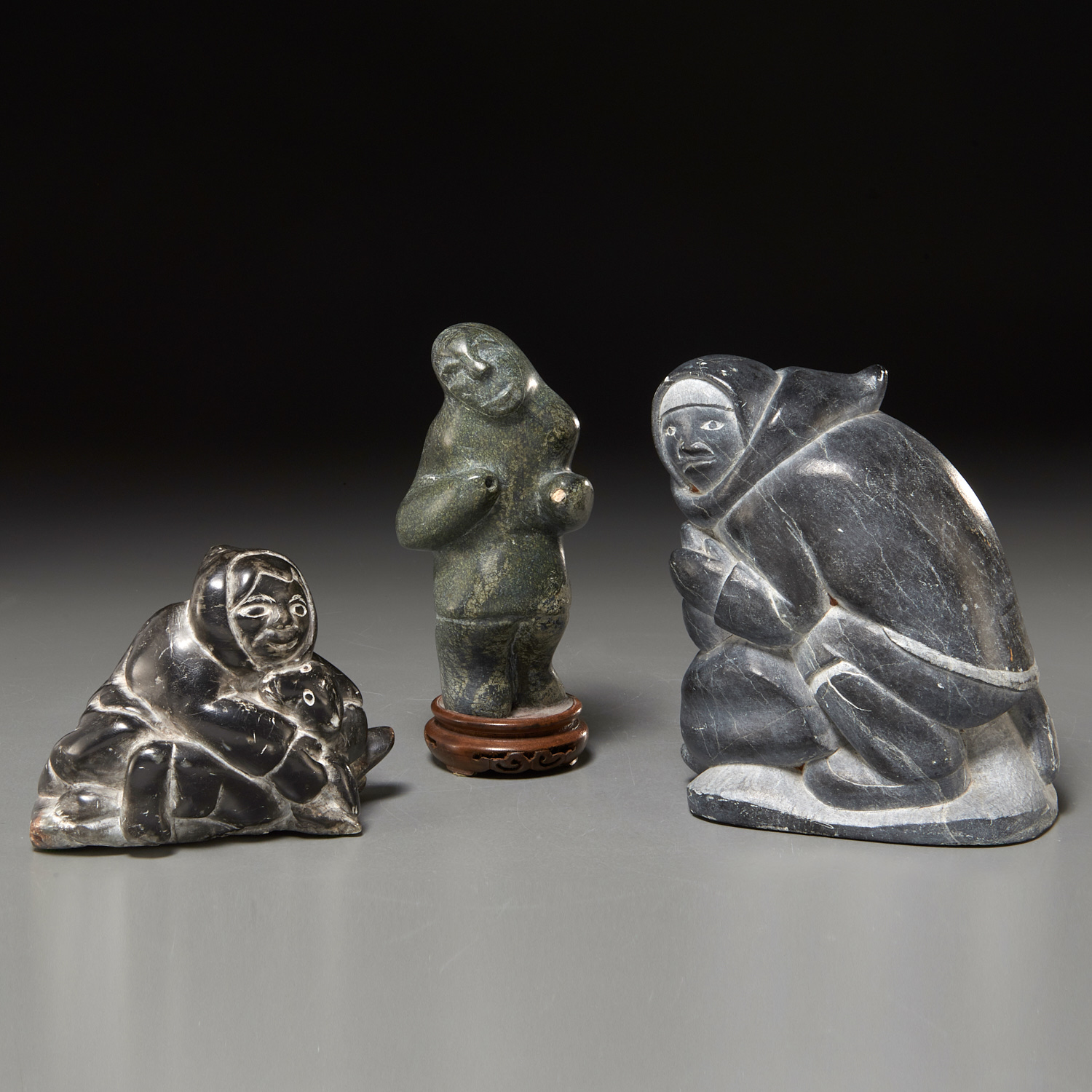 Appraisal: INUIT STONE FIGURES INCL JOE POODLAT Mid- th c Puvirnituq