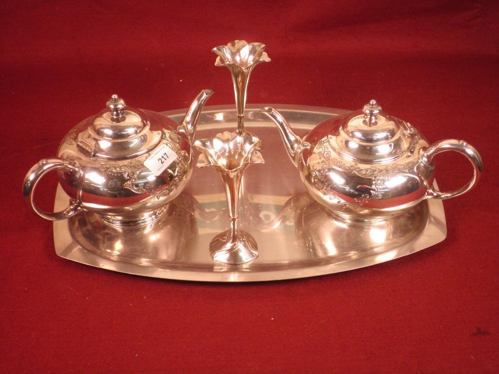 Appraisal: A pair of electro plated base metal teapots a pair