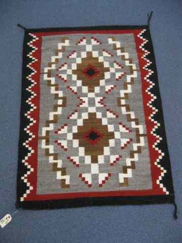 Appraisal: Navaho Indian Rug geometric designs red brown ivory gray ''