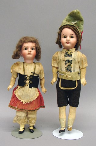 Appraisal: Pair of German costume dolls Girl - G-K in sunburst