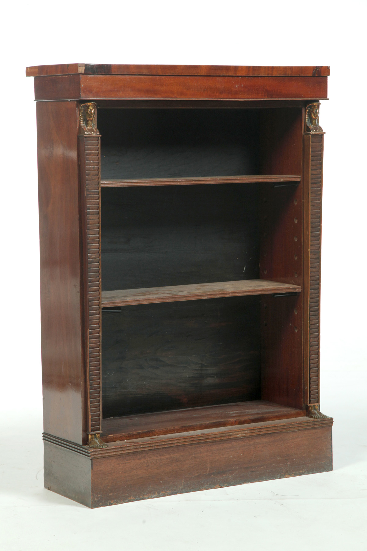 Appraisal: EGYPTIAN REVIVAL-STYLE BOOKCASE Twentieth century mahogany Adjustable shelves flanked by