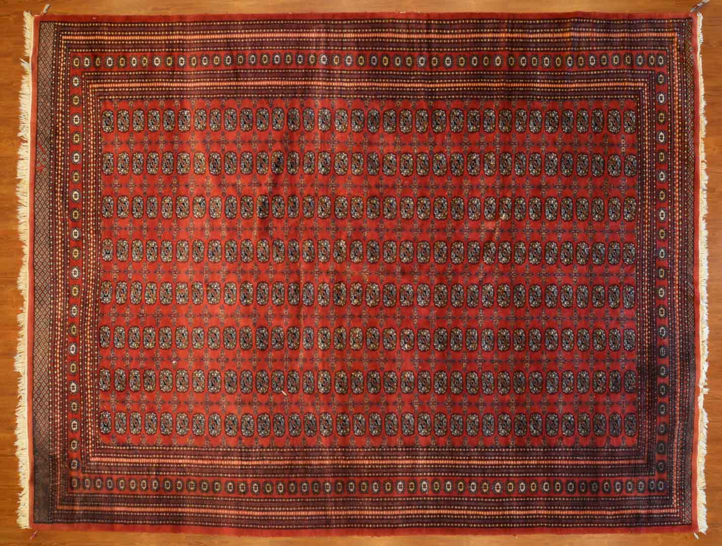 Appraisal: Bohkara carpet approx x Pakistan circa Condition Sun fade and