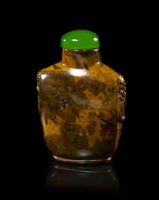 Appraisal: A Naturalistic Amber Snuff Bottle of compressed flask form having