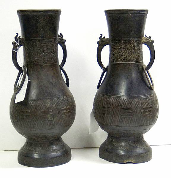 Appraisal: A pair of bronze vases Each of pear shape on