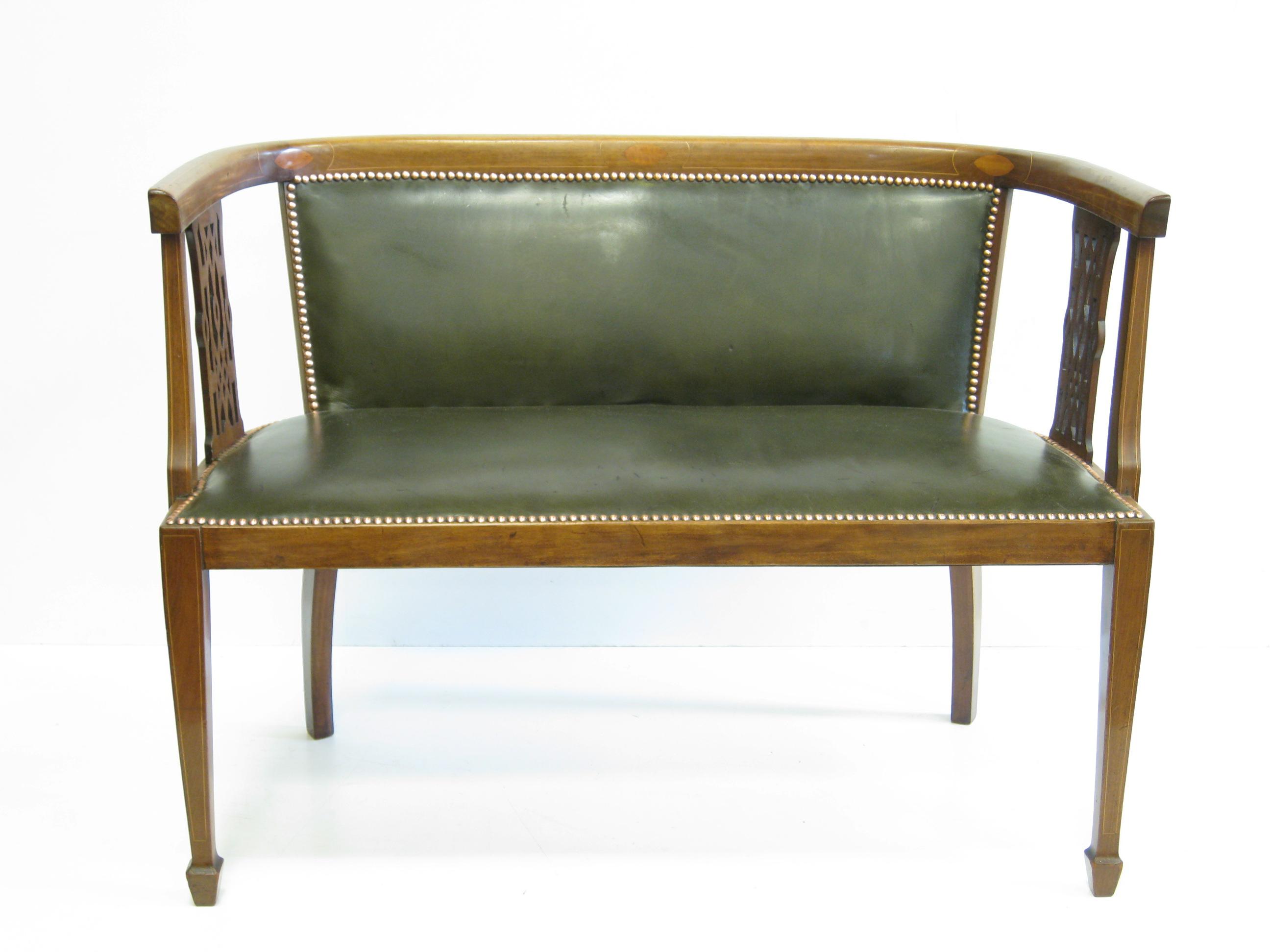 Appraisal: An Edwardian mahogany Settee leather upholstered on squared tapering supports