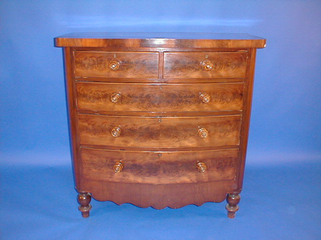 Appraisal: A Victorian flamed mahogany bow front chest of two short