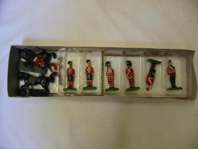 Appraisal: Six William Grant metal Guardsmen figures and two mounted bandsmen