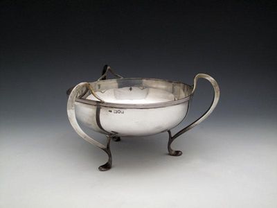 Appraisal: An Edwardian silver three-handled bowl by James Aitchison London circular