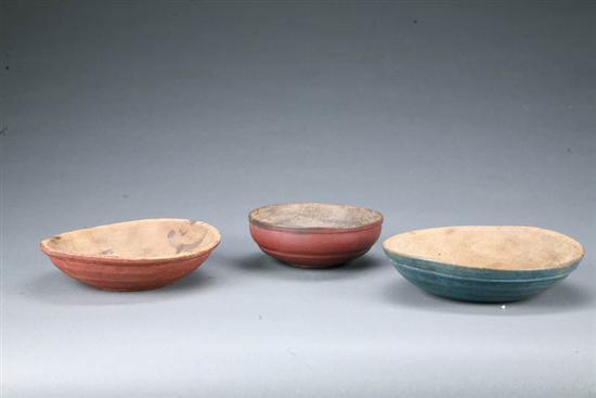 Appraisal: THREE PAINTED TREEN BOWLS American th century maple and softwood