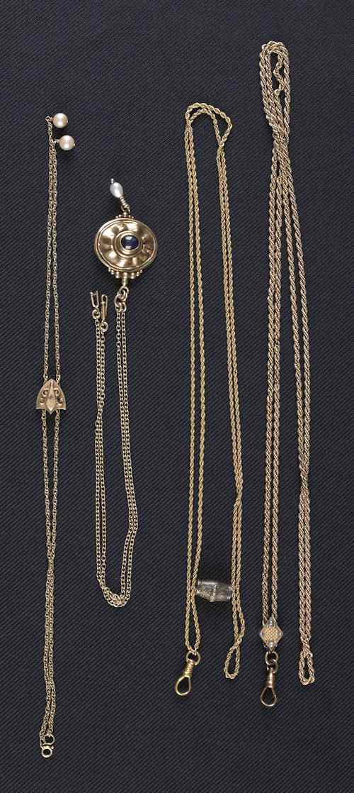 Appraisal: Three K yellow gold chains and one gold-filled chain decorated