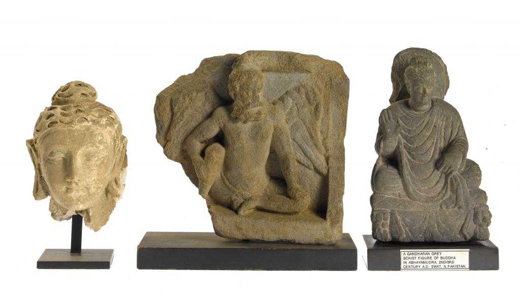 Appraisal: TWO GANDHARAN SCHIST SCULPTURES AND A STUCCO BUST C RD-