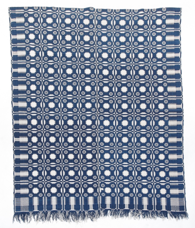 Appraisal: Mid th century Blue and white jacquard coverlet with pine