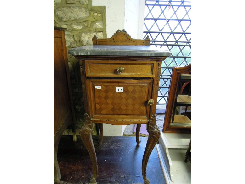 Appraisal: A French walnut pot cupboard with marble top over a