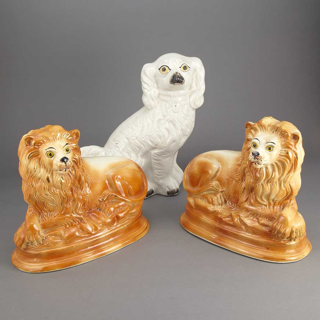 Appraisal: Pair of Staffordshire Pottery Figures of Lions th Century Each