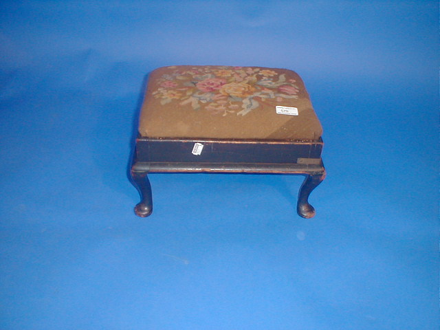 Appraisal: A Victorian footstool with cabriole legs and needlework top