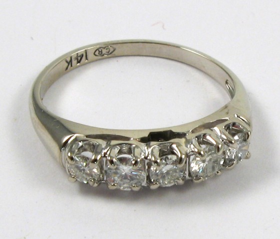 Appraisal: DIAMOND AND FOURTEEN KARAT GOLD RING The white gold band