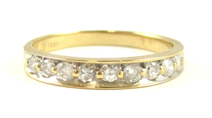 Appraisal: DIAMOND AND FOURTEEN KARAT GOLD RING set with nine round-cut