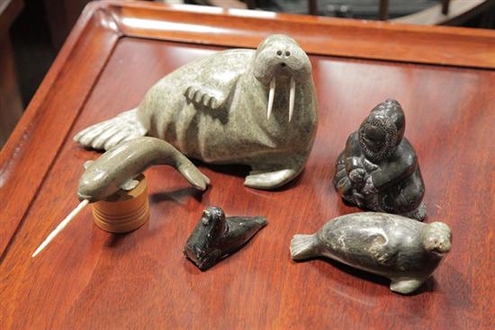 Appraisal: FIVE PIECES OF CARVED SOAPSTONE Inuit carvings depicting two walrus