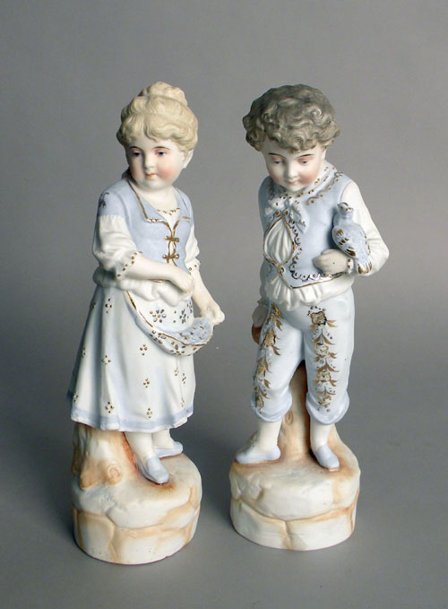 Appraisal: Pair of bisque figures of a boy and girl h