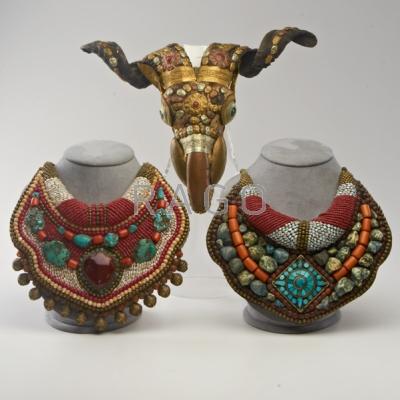 Appraisal: TIBETAN Three pieces th c two Ladakh gorgets set with