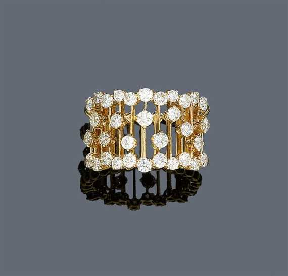 Appraisal: DIAMOND RING Pink gold Decorative band ring the open-worked surface