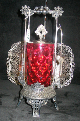 Appraisal: AN MID- TH CENTURY RUBY GLASS PICKLE CASTER having an