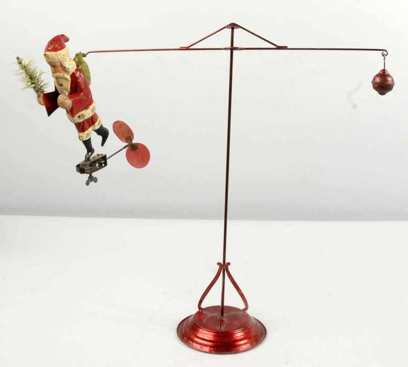 Appraisal: Tin Santa Go-Round Wind-Up Toy Description Possibly Germany Working Cardboard