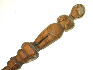 Appraisal: An African wooden stick carved with two climbing figures and