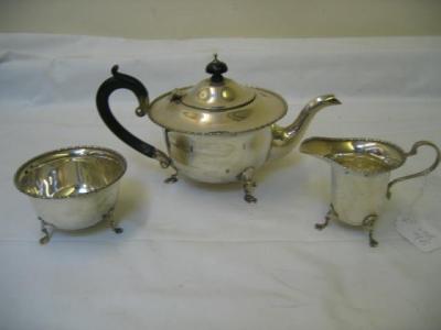 Appraisal: A THREE PIECE TEA SET of circular tapering form with