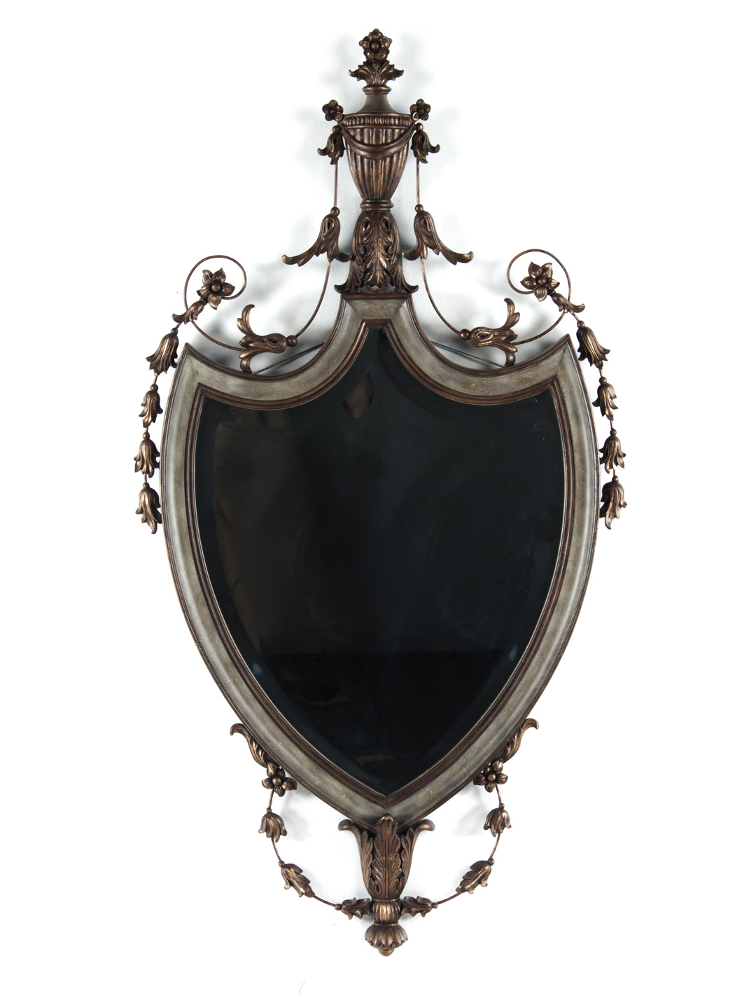 Appraisal: Italian Neoclassical style shield-form mirror with beveled glass and applied