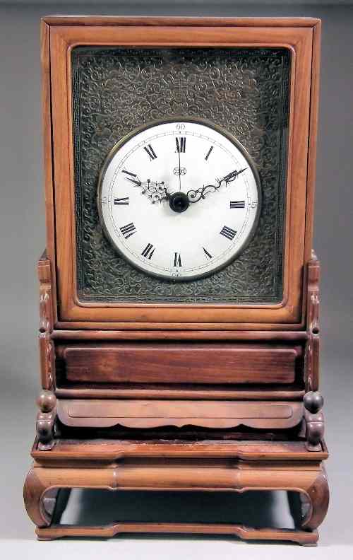 Appraisal: A th Century Chinese rosewood cased mantel clock the ins