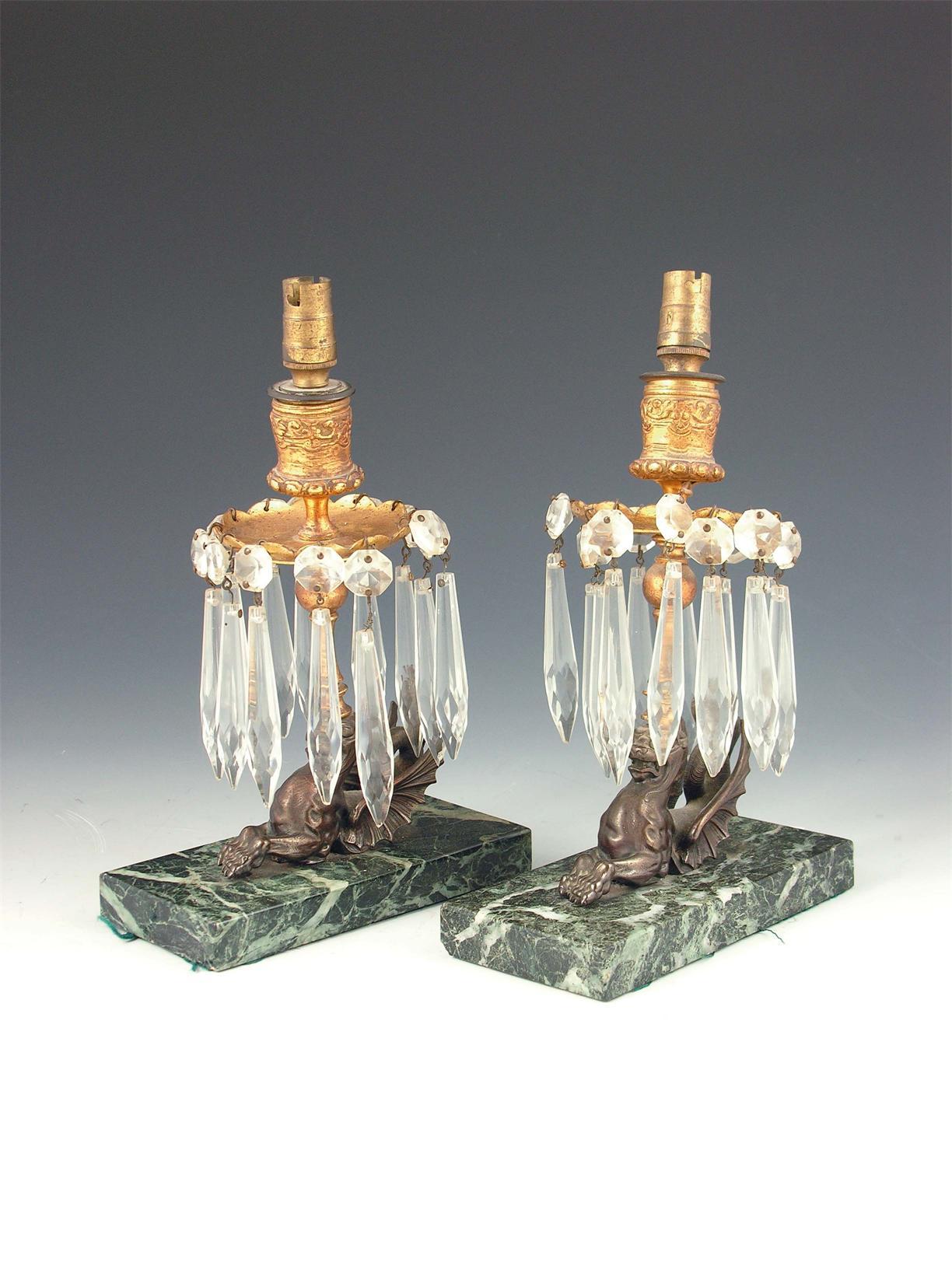 Appraisal: A pair of bronze candlesticks