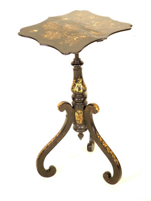 Appraisal: A Victorian papier mache lacquered table the serpentine top with