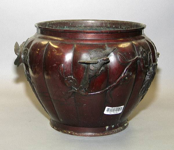 Appraisal: A patinated copper alloy jardini re Cast with birds and