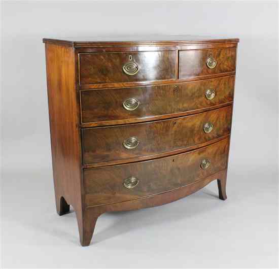 Appraisal: A late George III mahogany bow front chest on splayed