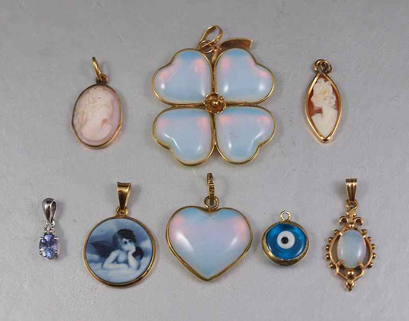 Appraisal: GROUP OF GOLD PENDANTS K K and K gold pendants