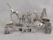 Appraisal: Silver miniatures A gondola cm and fourteen other miniatures one