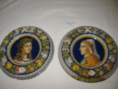 Appraisal: A PAIR OF CONTINENTAL MAIOLICA PLAQUES of circular form painted