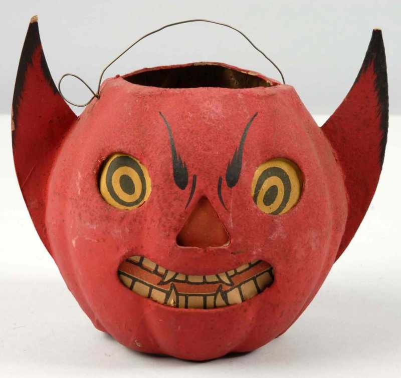 Appraisal: German Halloween Devil Jack-O-Lantern Description Original paper inserts No bottom