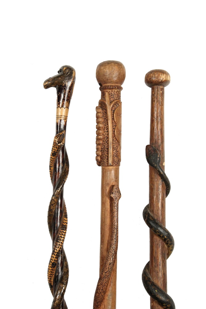 Appraisal: FOLK ART WALKING STICKS - th c Carved Wood Sticks