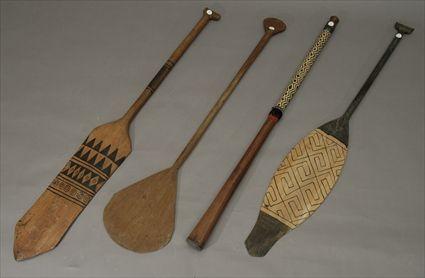 Appraisal: Three African Oars Together with a club with rattan grip