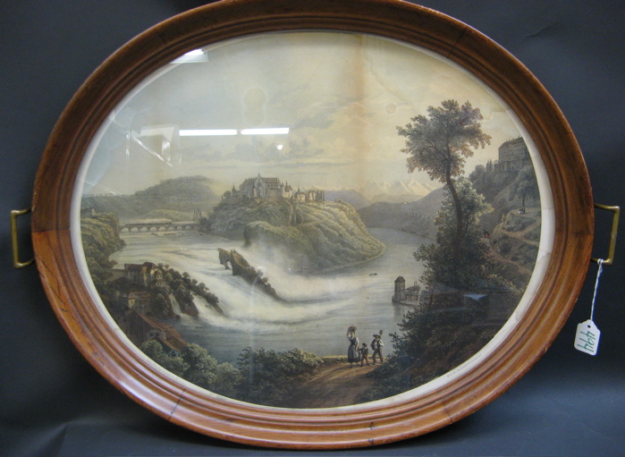 Appraisal: FRENCH OVAL HARDWOOD SERVING TRAY fitted with a lithograph landscape