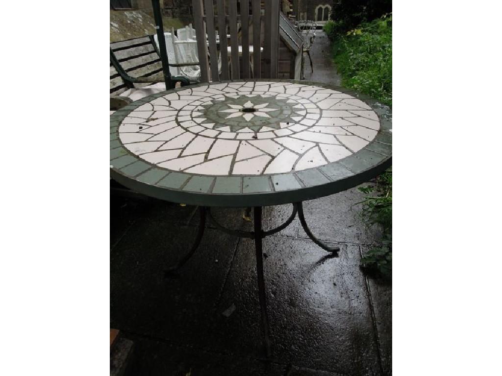 Appraisal: A contemporary iron framed garden table of circular form with