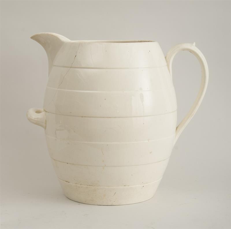 Appraisal: ENGLISH IVORY-GLAZED POTTERY BARREL-FORM JUG The four-banded bowl with bracket